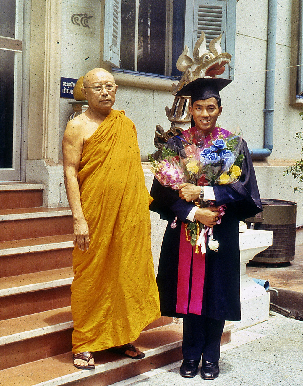 Photograph taken when receiving my Master's degree, with Somdet Phra Buddhachinnawong, the abbot of Wat Benchamabophit (31 June 1988).